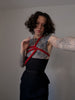 Male model in a corset with shibari rope